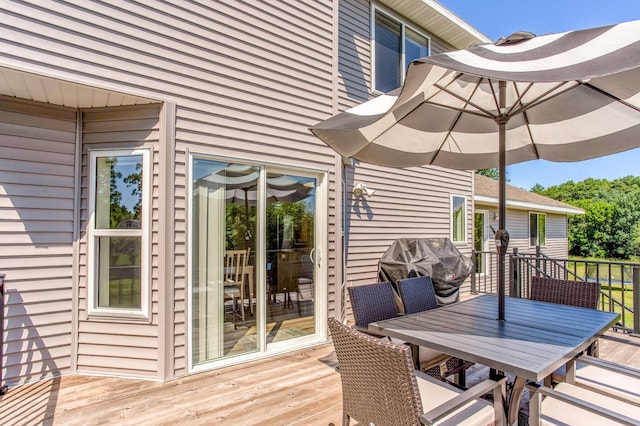 141 145th Ln NE, Ham Lake, MN 55304 - wooden deck featuring outdoor dining space