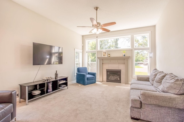 141 145th Ln NE, Ham Lake, MN 55304 - living area featuring a ceiling fan, carpet flooring, and a tile fireplace