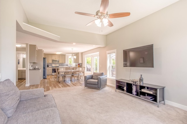 141 145th Ln NE, Ham Lake, MN 55304 - living area featuring a ceiling fan, light carpet, and a chandelier