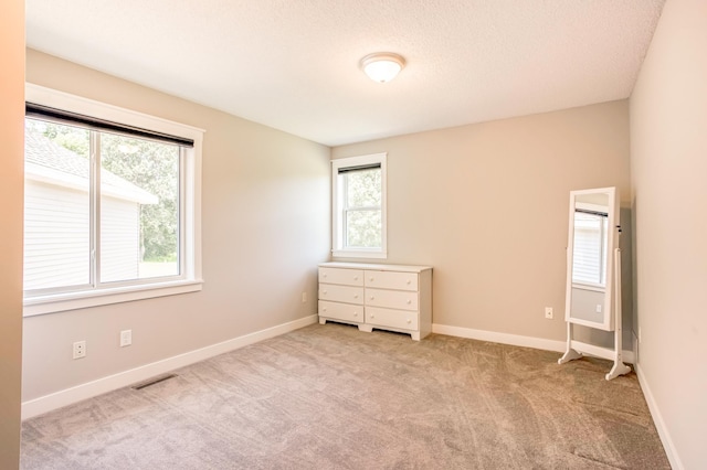 141 145th Ln NE, Ham Lake, MN 55304 - carpeted spare room with baseboards