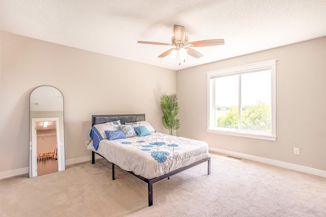 141 145th Ln NE, Ham Lake, MN 55304 - bedroom featuring light carpet and ceiling fan