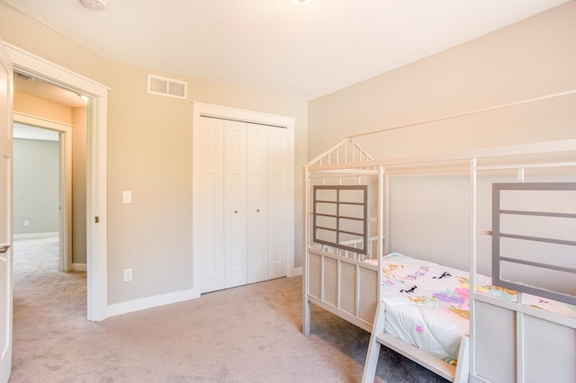 141 145th Ln NE, Ham Lake, MN 55304 - carpeted bedroom featuring baseboards and a closet