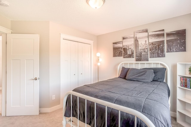 141 145th Ln NE, Ham Lake, MN 55304 - carpeted bedroom featuring a closet and baseboards
