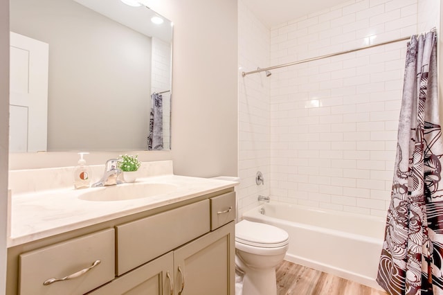 141 145th Ln NE, Ham Lake, MN 55304 - full bathroom featuring vanity, wood finished floors, and shower / bath combo with shower curtain