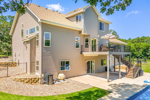 141 145th Ln NE, Ham Lake, MN 55304 - rear view of house featuring stairs, a patio area, a wooden deck, and a shingled roof