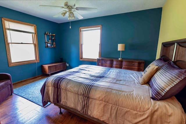 63714 Hannu Ln, Pine Lake Twp, MN 55735 - bedroom with wood finished floors and a ceiling fan