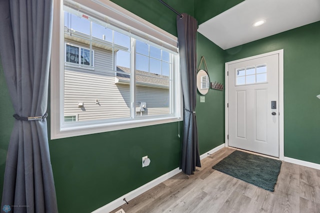 1009 Highland Ln W, West Fargo, ND 58078 - foyer featuring healthy amount of natural light and wood finished floors