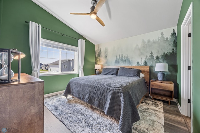 1009 Highland Ln W, West Fargo, ND 58078 - bedroom featuring vaulted ceiling, wood finished floors, and a ceiling fan