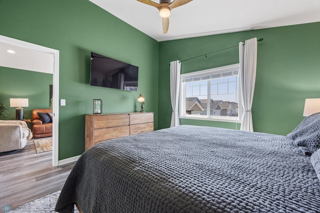 1009 Highland Ln W, West Fargo, ND 58078 - bedroom with wood finished floors and a ceiling fan