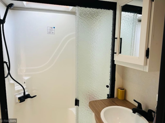 23488 Waskawood Rd # 110, Long Beach, MN 56334 - full bathroom featuring a shower and vanity