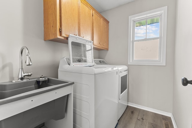 6913 174th St W, Farmington, MN 55024 - laundry room with cabinet space, washing machine and clothes dryer, and dark wood-style floors