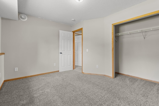 6913 174th St W, Farmington, MN 55024 - unfurnished bedroom featuring carpet flooring, a closet, and a textured ceiling