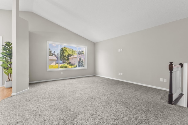 6913 174th St W, Farmington, MN 55024 - spare room featuring carpet and vaulted ceiling