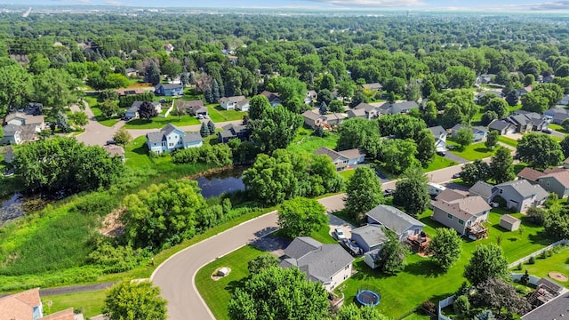 6913 174th St W, Farmington, MN 55024 - aerial view of residential area featuring a forest and a nearby body of water