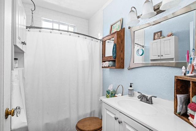 4918 Glenwood St, Duluth, MN 55804 - bathroom with vanity, shower / bathtub combination with curtain, and a textured wall