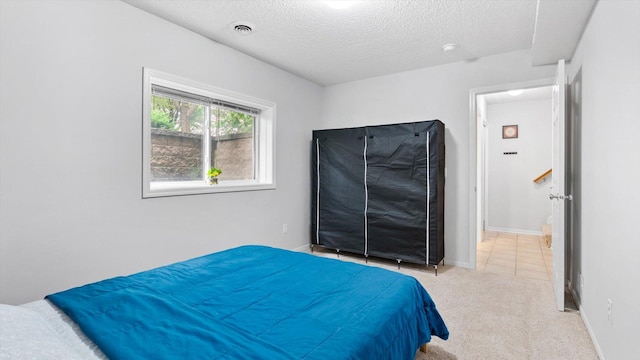 11333 Stratton Ave, Eden Prairie, MN 55344 - bedroom with a textured ceiling and light colored carpet