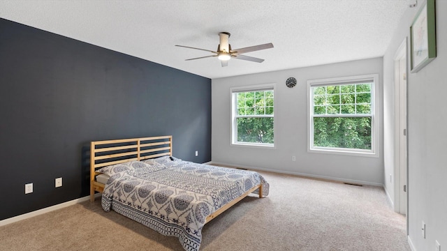 11333 Stratton Ave, Eden Prairie, MN 55344 - carpeted bedroom featuring a textured ceiling and a ceiling fan