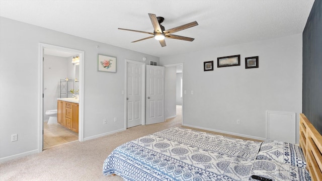 11333 Stratton Ave, Eden Prairie, MN 55344 - bedroom with light carpet, ensuite bath, and a ceiling fan