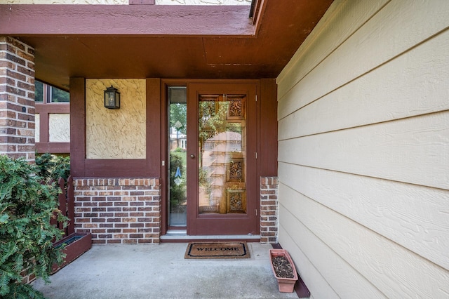 1306 Wynridge Dr, Arden Hills, MN 55112 - doorway to property with covered porch