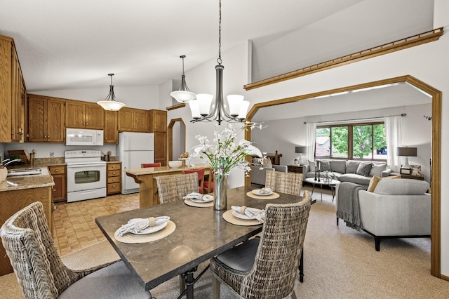 1306 Wynridge Dr, Arden Hills, MN 55112 - dining room featuring a chandelier and high vaulted ceiling