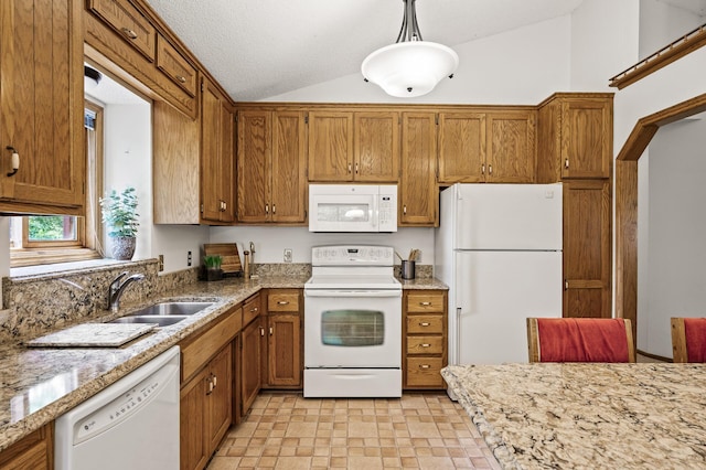 1306 Wynridge Dr, Arden Hills, MN 55112 - kitchen featuring white appliances, lofted ceiling, brown cabinets, decorative light fixtures, and light stone counters