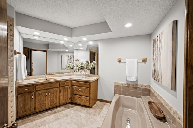 1306 Wynridge Dr, Arden Hills, MN 55112 - full bath with vanity, recessed lighting, a garden tub, and a textured ceiling
