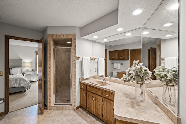 1306 Wynridge Dr, Arden Hills, MN 55112 - ensuite bathroom with vanity, a stall shower, recessed lighting, and a textured ceiling