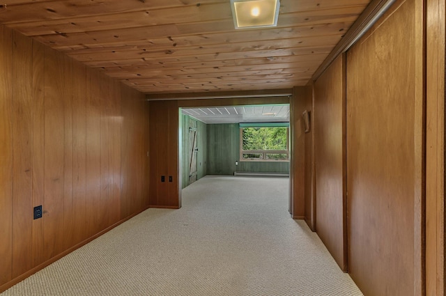 5848 16th Ave SE, Haven Twp, MN 56304 - hall featuring wood ceiling, carpet flooring, wooden walls, and a baseboard radiator
