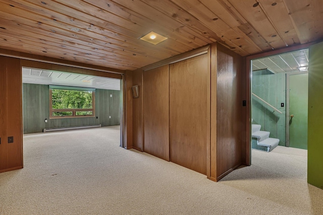 5848 16th Ave SE, Haven Twp, MN 56304 - hallway featuring a baseboard radiator, carpet flooring, wooden ceiling, stairway, and wood walls