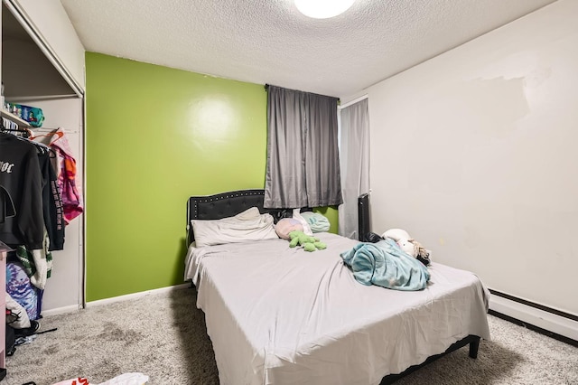 4010 15th Ave S Unit 6D, Minneapolis, MN 55407 - bedroom featuring a textured ceiling, carpet flooring, and a baseboard radiator