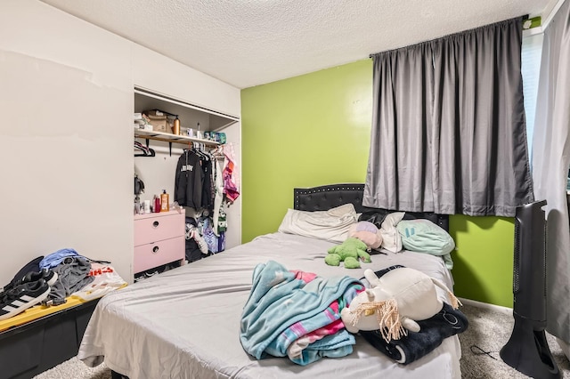 4010 15th Ave S Unit 6D, Minneapolis, MN 55407 - bedroom featuring a textured ceiling, a closet, and carpet flooring