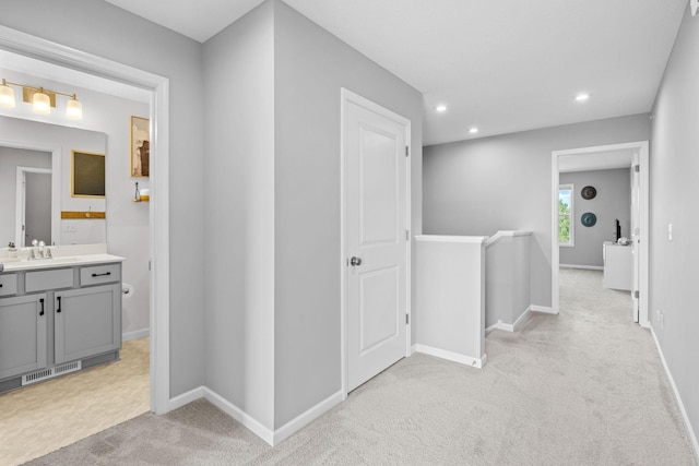 14811 Willemite St NW, Ramsey, MN 55303 - corridor with light colored carpet, an upstairs landing, and recessed lighting