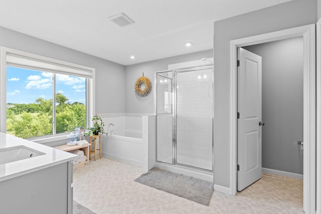 14811 Willemite St NW, Ramsey, MN 55303 - full bath with a stall shower, a garden tub, vanity, and recessed lighting