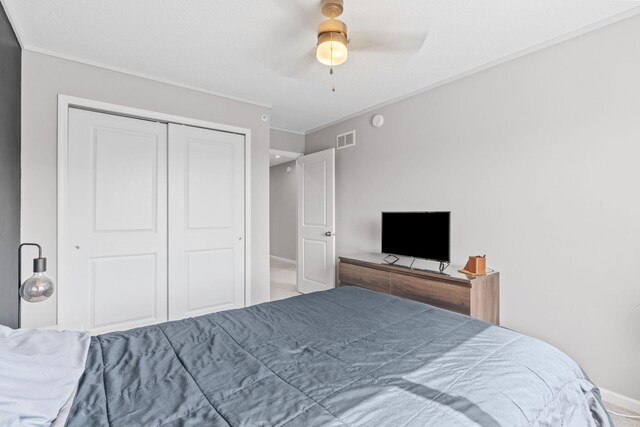 14811 Willemite St NW, Ramsey, MN 55303 - carpeted bedroom with crown molding, a closet, and ceiling fan