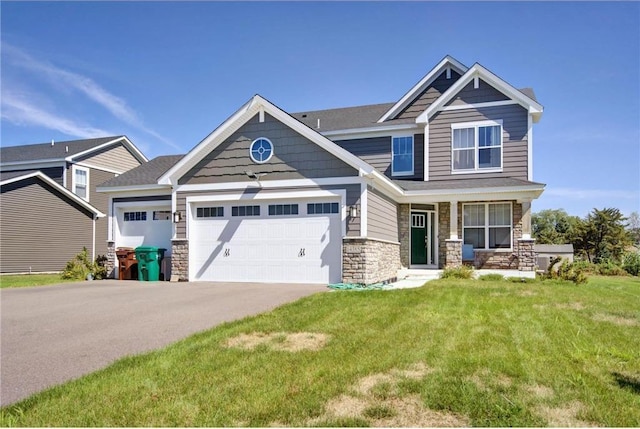 14385 Annapolis Ln N, Dayton, MN 55327 - craftsman house with a garage, stone siding, a front lawn, asphalt driveway, and a porch