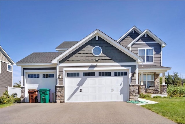 14385 Annapolis Ln N, Dayton, MN 55327 - craftsman-style home with stone siding, a garage, and driveway