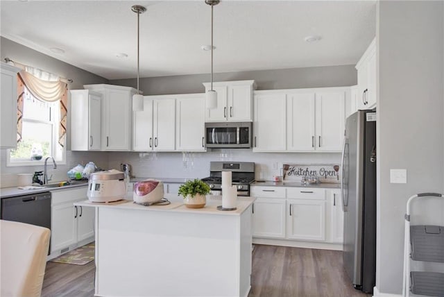 14385 Annapolis Ln N, Dayton, MN 55327 - kitchen with stainless steel appliances, wood finished floors, and white cabinetry