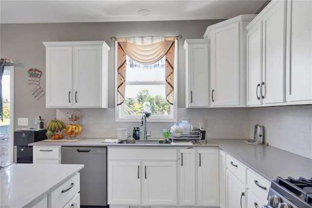 14385 Annapolis Ln N, Dayton, MN 55327 - kitchen featuring dishwasher, light countertops, white cabinets, decorative backsplash, and healthy amount of natural light