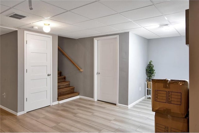 14385 Annapolis Ln N, Dayton, MN 55327 - finished basement featuring a drop ceiling, light wood-style flooring, and stairway