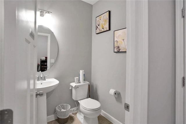 14385 Annapolis Ln N, Dayton, MN 55327 - half bathroom featuring toilet and baseboards
