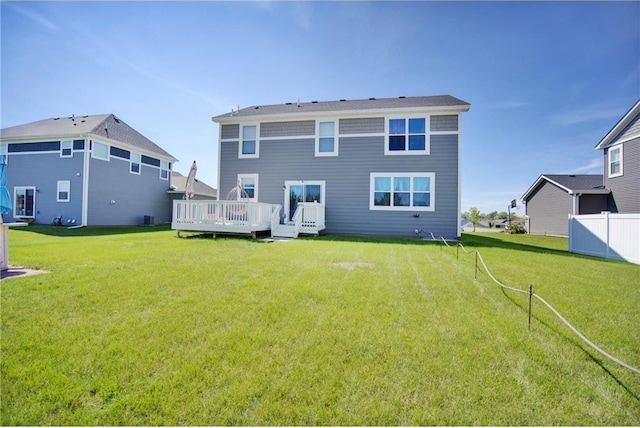 14385 Annapolis Ln N, Dayton, MN 55327 - back of property with a wooden deck and a lawn