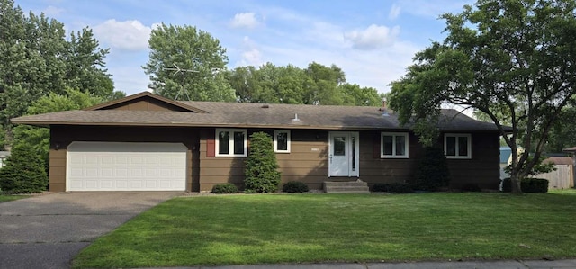 16660 Garland Way W, Lakeville, MN 55068 - ranch-style home with entry steps, driveway, an attached garage, a front lawn, and a shingled roof
