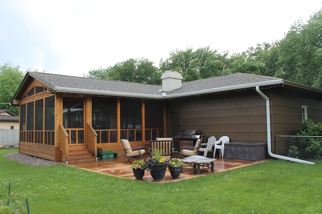 16660 Garland Way W, Lakeville, MN 55068 - rear view of property featuring a sunroom, a shingled roof, a chimney, and a patio
