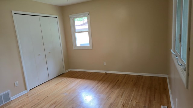 16660 Garland Way W, Lakeville, MN 55068 - unfurnished bedroom with light wood-style flooring and a closet