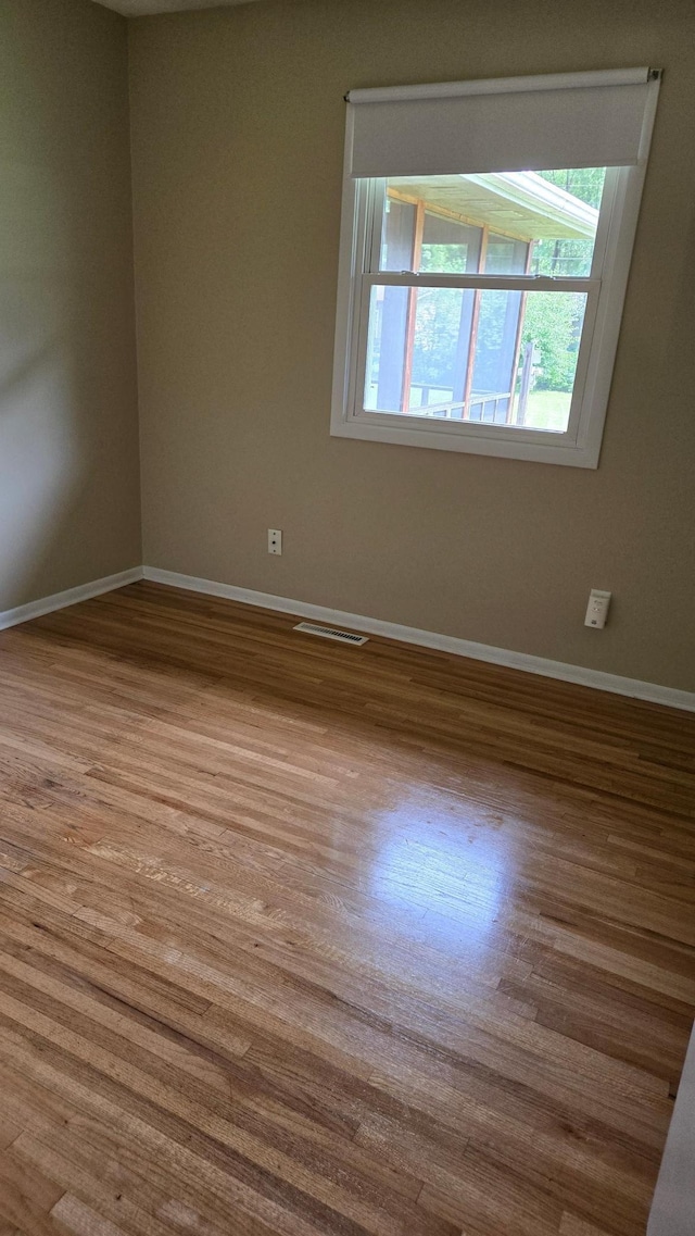 16660 Garland Way W, Lakeville, MN 55068 - unfurnished room with baseboards and wood finished floors