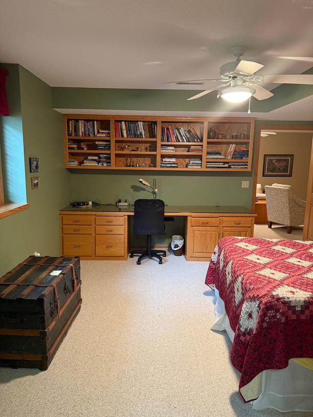 527 Woodside Ct, Shakopee, MN 55379 - bedroom featuring built in desk, light colored carpet, and a ceiling fan