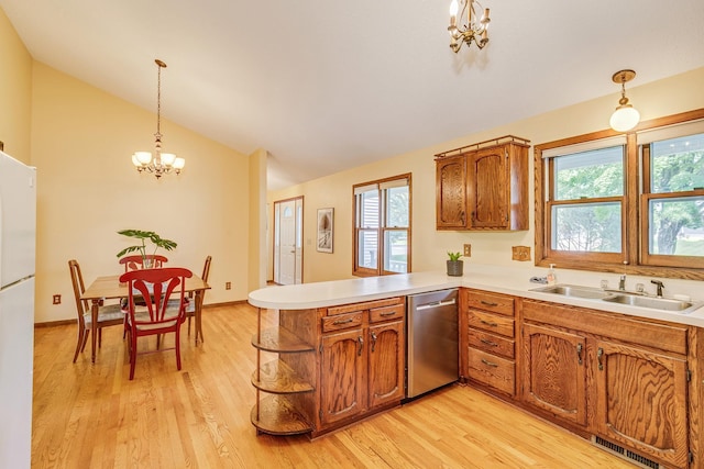 5577 Alameda St, Shoreview, MN 55126 - kitchen featuring a chandelier, a peninsula, brown cabinets, vaulted ceiling, and pendant lighting