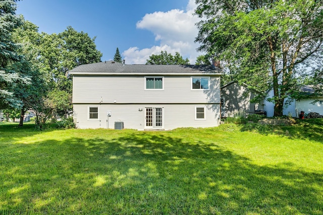 5577 Alameda St, Shoreview, MN 55126 - rear view of property with a lawn and a chimney