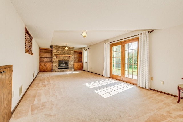 5577 Alameda St, Shoreview, MN 55126 - unfurnished living room featuring built in shelves, carpet flooring, and a fireplace