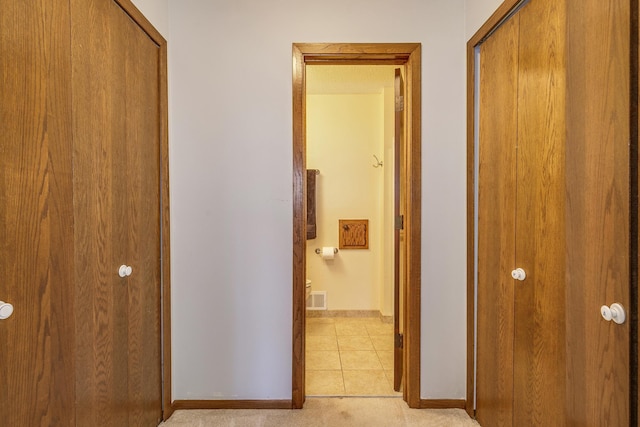 5577 Alameda St, Shoreview, MN 55126 - hall featuring baseboards and light tile patterned flooring
